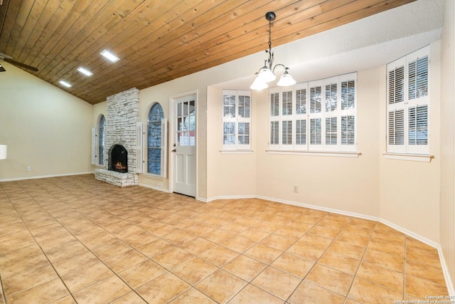 unfurnished living room featuring lofted ceiling, wooden ceiling, and a stone fireplace