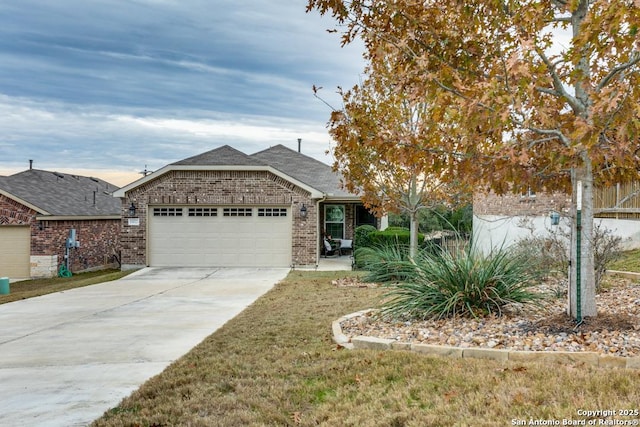 view of front of home featuring a garage and a front yard