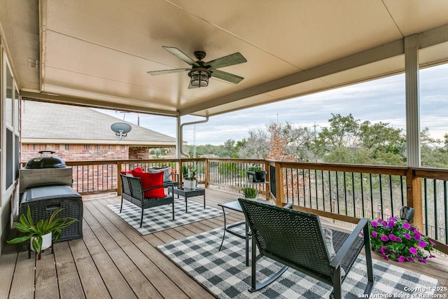 deck featuring an outdoor hangout area and ceiling fan