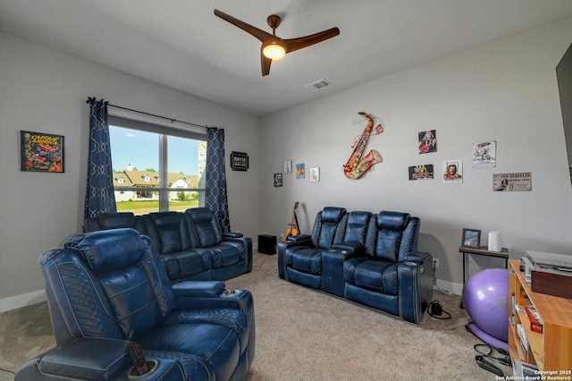 carpeted living room with ceiling fan