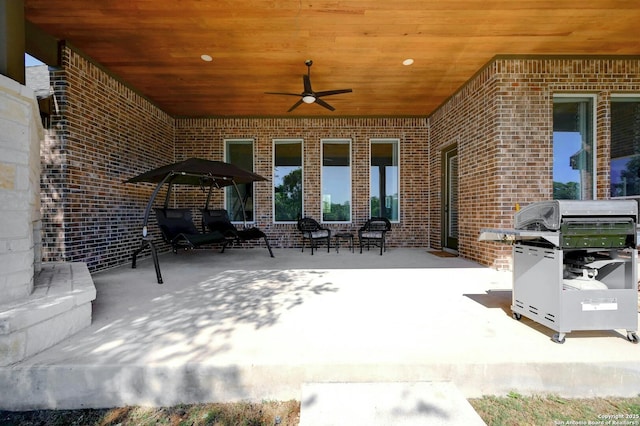 view of patio / terrace with grilling area and ceiling fan