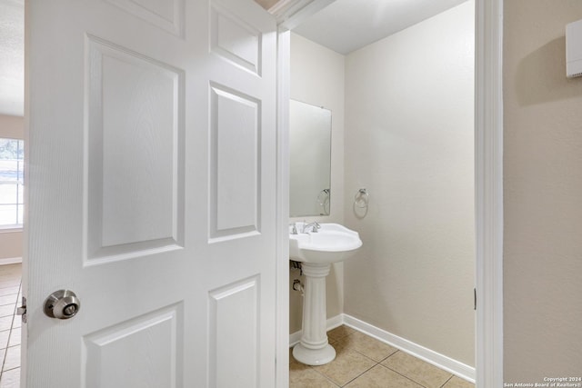 bathroom with tile patterned flooring