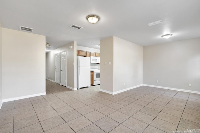 empty room featuring light tile patterned floors