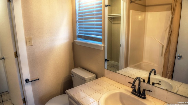 bathroom with vanity, walk in shower, and toilet