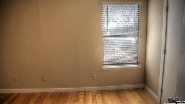 spare room featuring light wood-type flooring