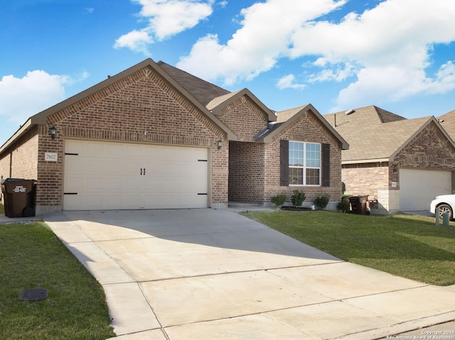 ranch-style house with a garage, brick siding, concrete driveway, roof with shingles, and a front yard