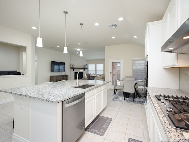 kitchen featuring sink, white cabinets, stainless steel appliances, a center island with sink, and wall chimney exhaust hood