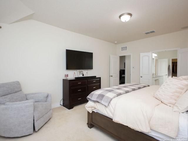 bedroom featuring light colored carpet