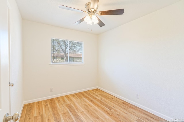 empty room with ceiling fan and light wood-type flooring