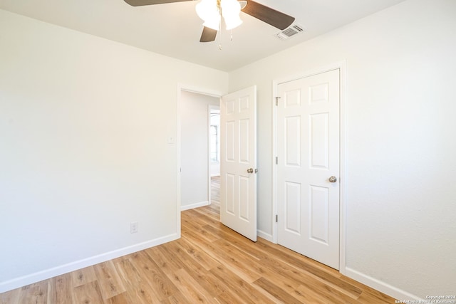 unfurnished bedroom featuring light hardwood / wood-style floors and ceiling fan