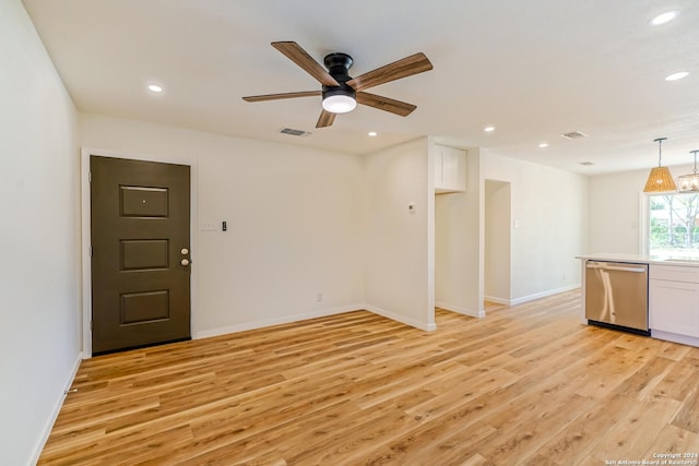 unfurnished living room with ceiling fan and light hardwood / wood-style floors