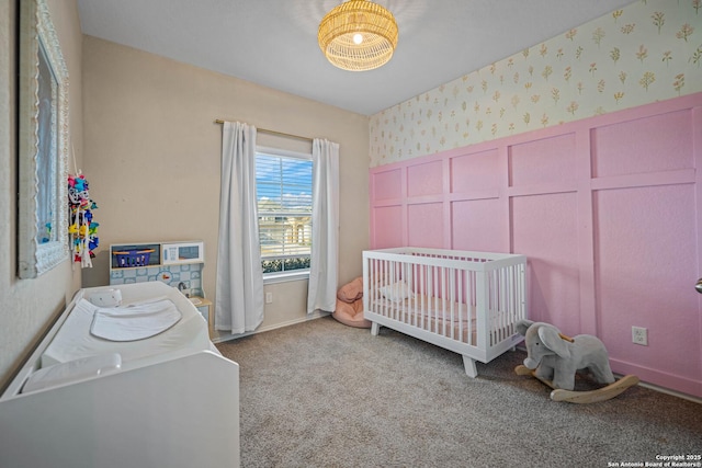 carpeted bedroom with a crib