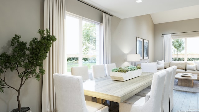 dining space with wood-type flooring