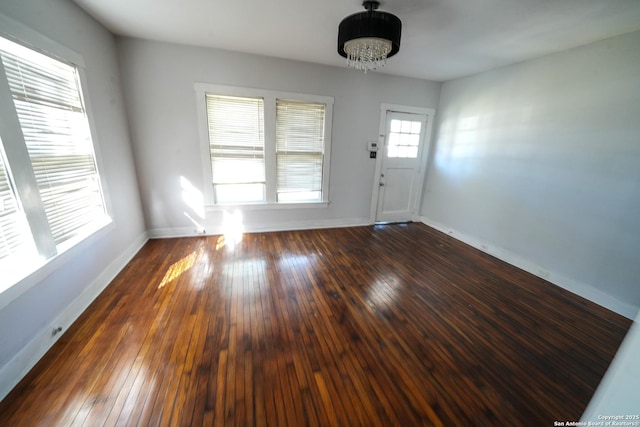 entryway with dark hardwood / wood-style floors