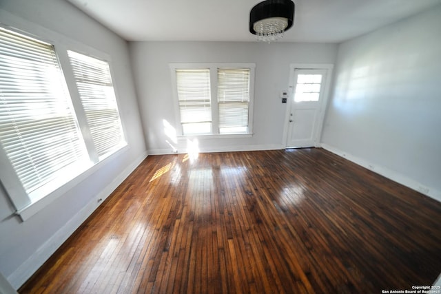 interior space with dark hardwood / wood-style flooring