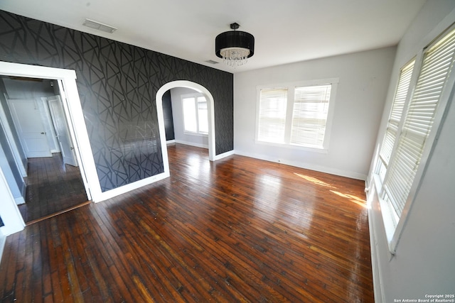 empty room with dark wood-type flooring