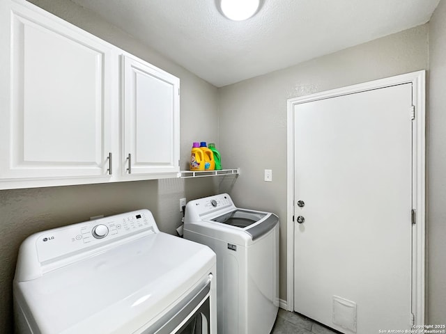 laundry room with cabinet space and separate washer and dryer