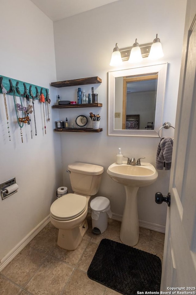 bathroom with toilet and sink