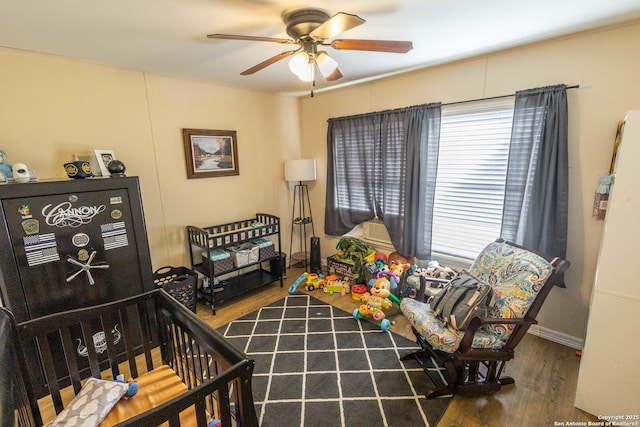 living room featuring a wealth of natural light, hardwood / wood-style floors, and ceiling fan