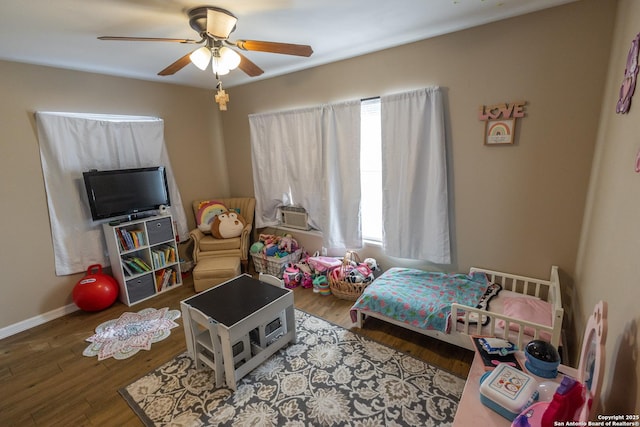 bedroom featuring light wood-type flooring and ceiling fan