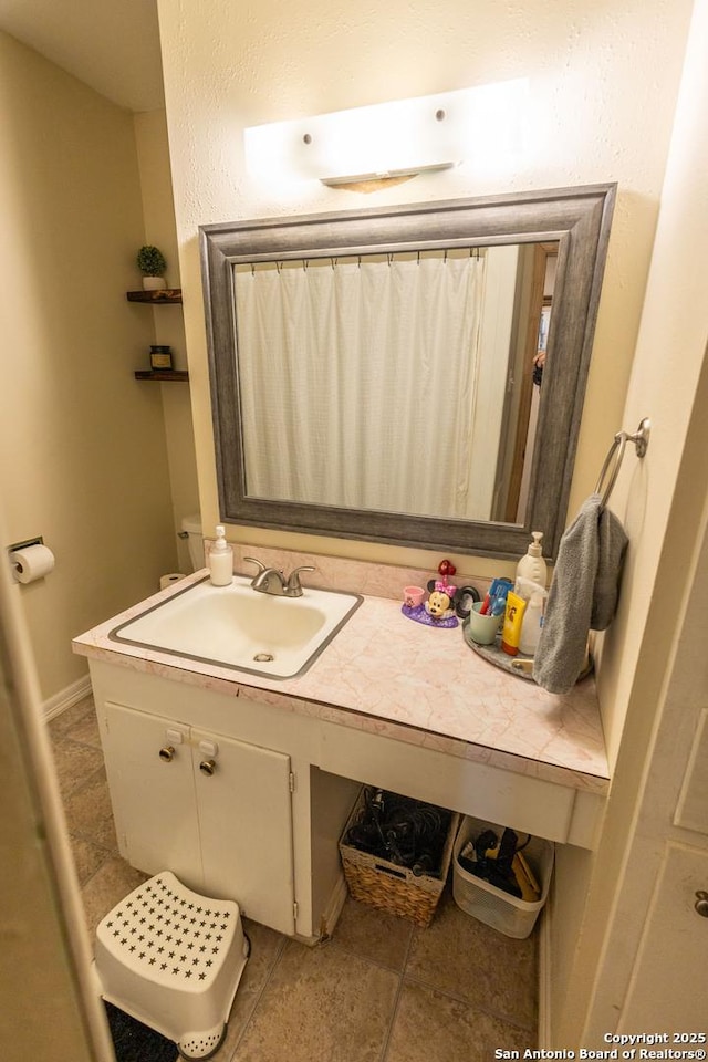 bathroom with vanity and walk in shower