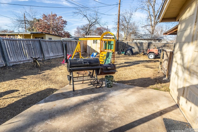 view of yard with a playground and a patio