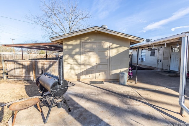 exterior space featuring cooling unit and a shed