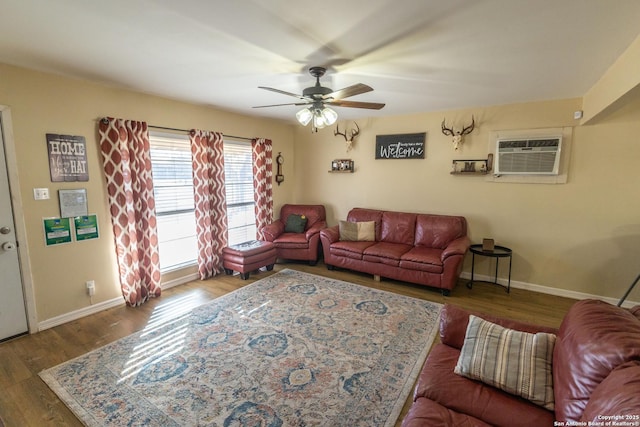 living room with ceiling fan, dark hardwood / wood-style floors, and a wall mounted AC