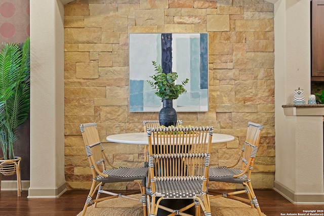 dining space featuring dark wood-type flooring