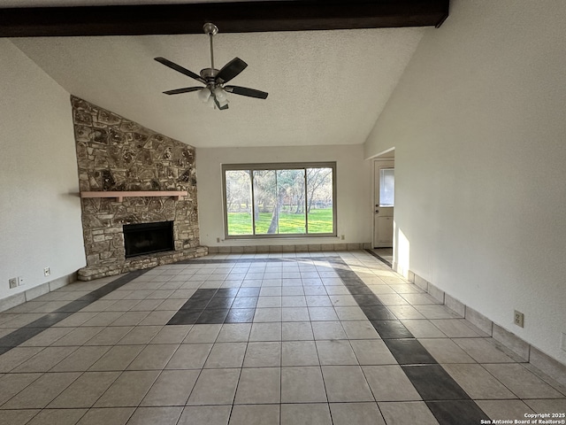 unfurnished living room featuring light tile patterned flooring, a stone fireplace, high vaulted ceiling, beamed ceiling, and ceiling fan