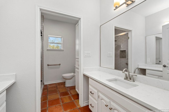 bathroom featuring vanity, a shower, and toilet