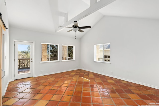 spare room with tile patterned floors, beam ceiling, high vaulted ceiling, ceiling fan, and a barn door