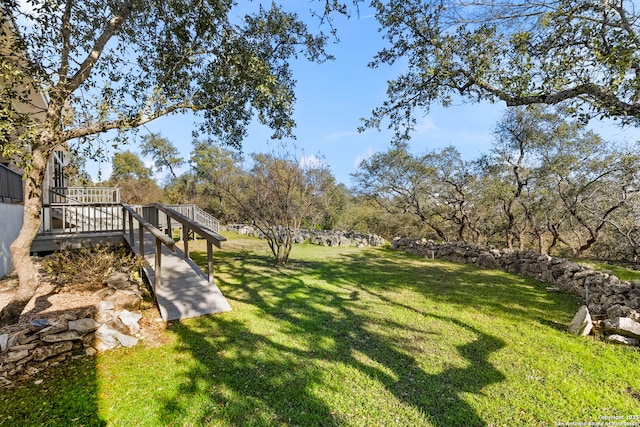 view of yard with a wooden deck