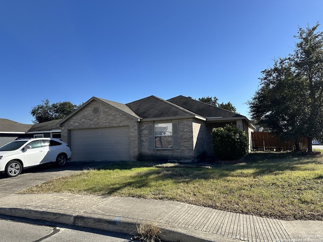 ranch-style home with a garage and a front yard