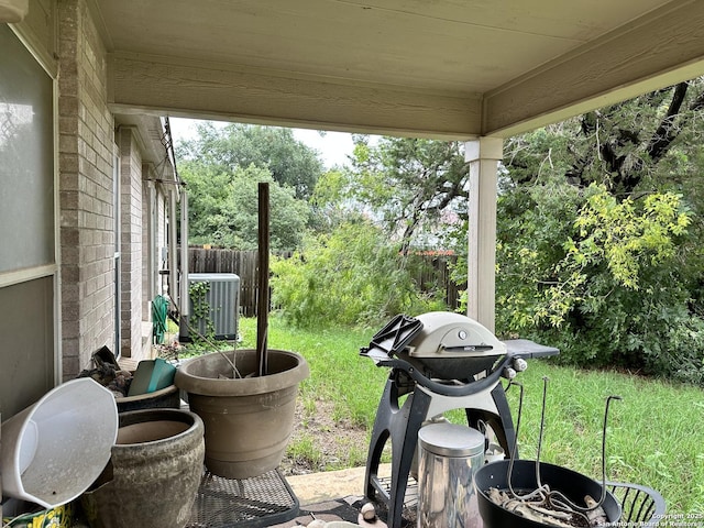 view of patio / terrace with cooling unit and area for grilling