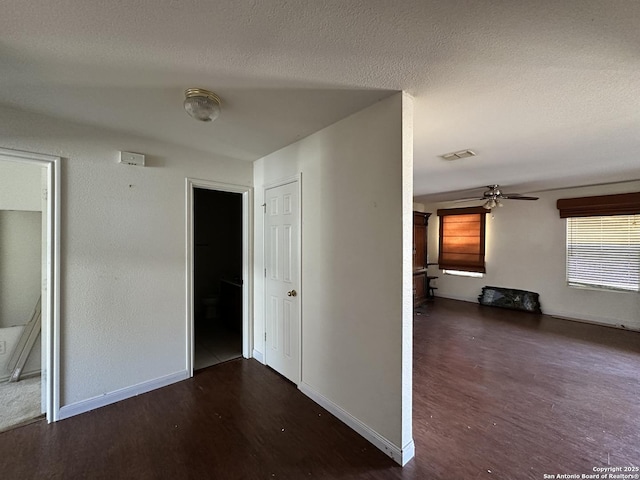 hallway featuring dark wood-type flooring