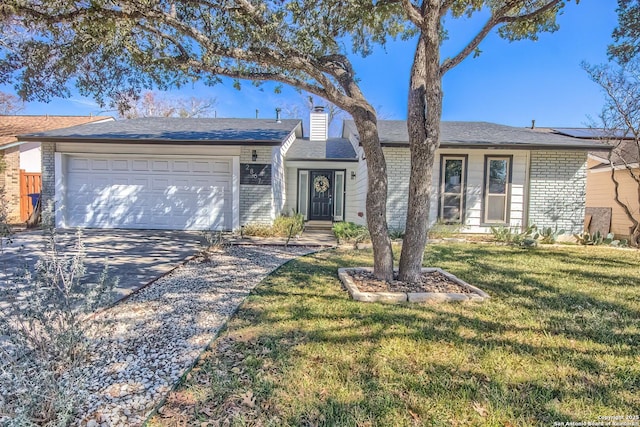 ranch-style house with a garage and a front lawn