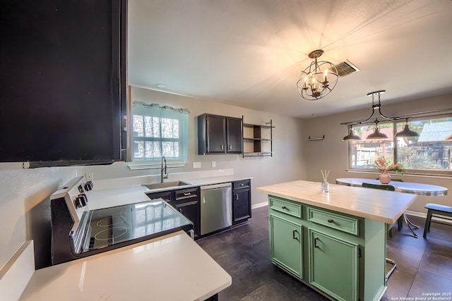 kitchen with a kitchen island, sink, green cabinets, and appliances with stainless steel finishes