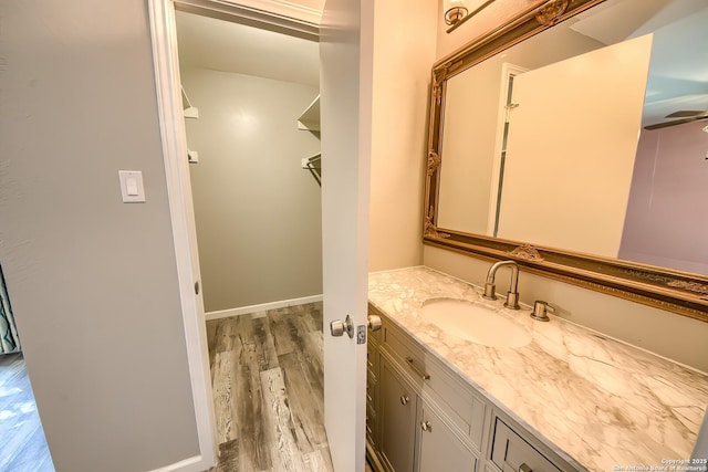 bathroom with vanity and hardwood / wood-style floors