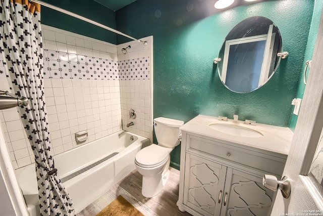 full bathroom with shower / tub combo with curtain, hardwood / wood-style floors, vanity, and toilet