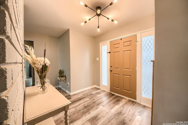 entryway with hardwood / wood-style floors