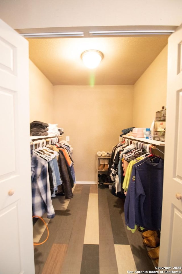 walk in closet featuring hardwood / wood-style flooring