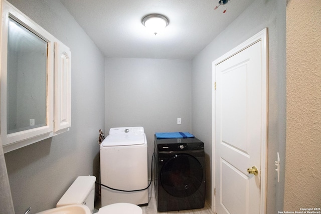 laundry room with washer and dryer