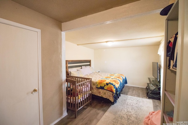 bedroom featuring hardwood / wood-style flooring