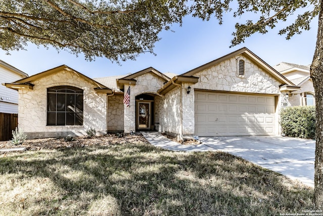 view of front of house featuring a garage and a front yard