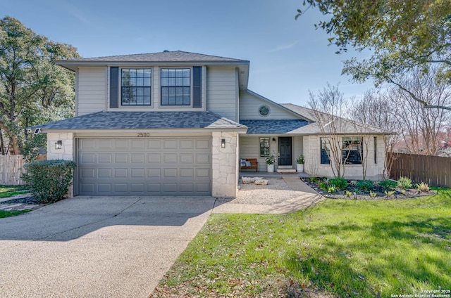 view of front property with a garage and a front yard