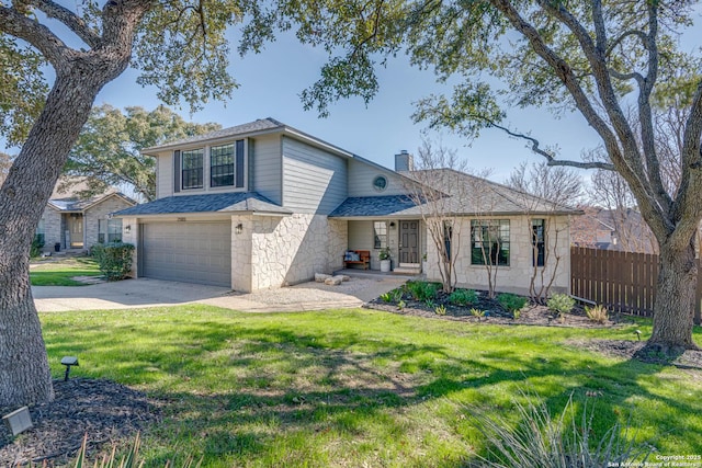 front facade featuring a garage and a front lawn