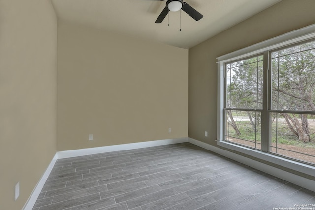 spare room with plenty of natural light and ceiling fan