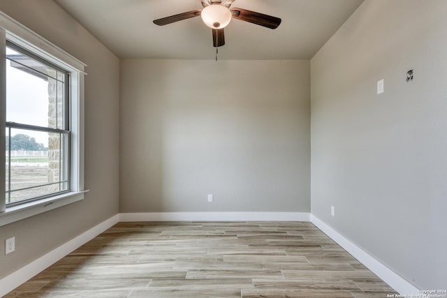 unfurnished room with light hardwood / wood-style flooring and ceiling fan