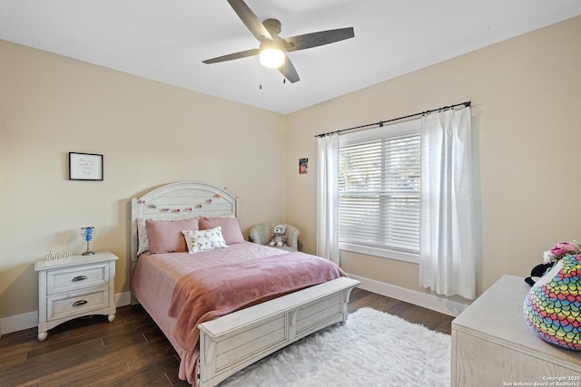 bedroom with dark wood-type flooring and ceiling fan